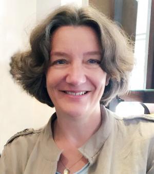 head and shoulders shot of Professor Karen O’Brien smiling and wearing open jacket