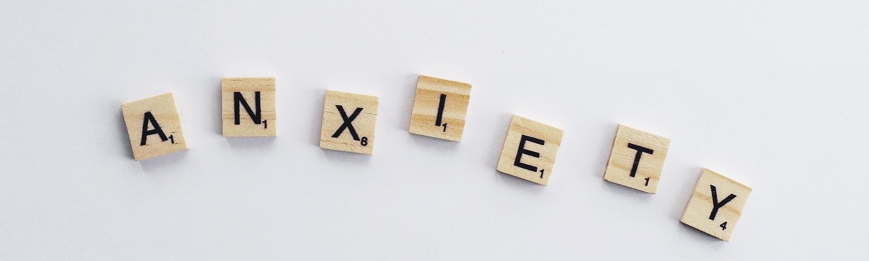 The word 'anxiety' written with scrabble blocks 