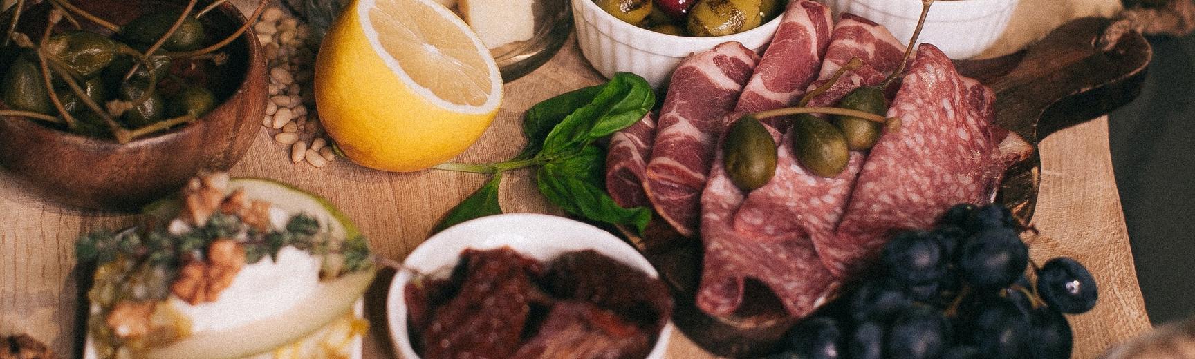 Tapas food arranged on a wooden board