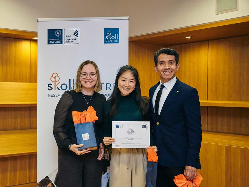Katie Wallis, Megan Liu and Carlos Araujo at the 2025 Map the System case competition
