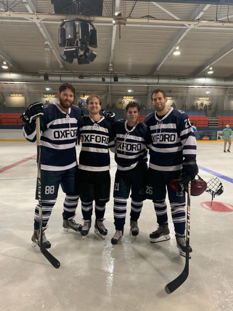 Jake Schneider stood on the ice rink with three teammates 