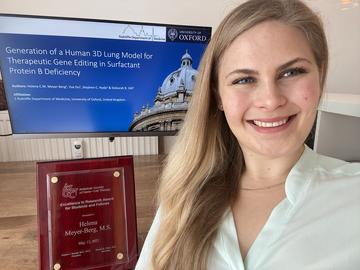 A shot of Helena Meyer-Berg with her Excellence in Research Award 