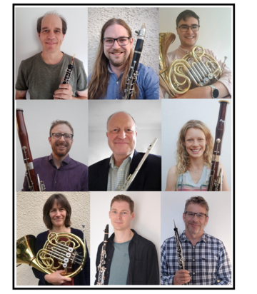 nine people holding musical instruments (one flute, two clarinets, two oboes, two horns, two bassoons, one contrabassoon)