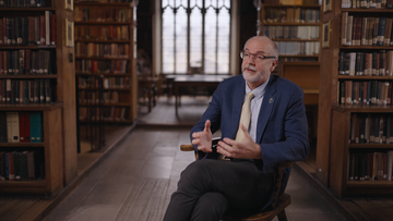 A shot of Professor Sir Andrew Pollard in the Pusey House Library