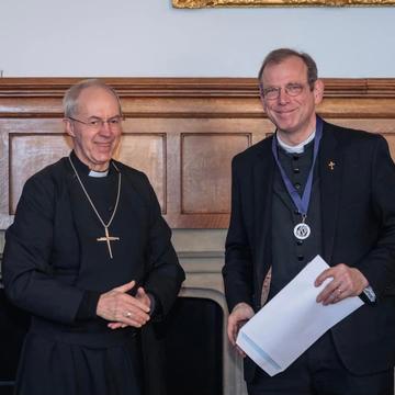 Father George receiving dunstan award