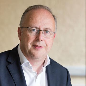 Portrait photograph of Professor Tim Orchard CBE